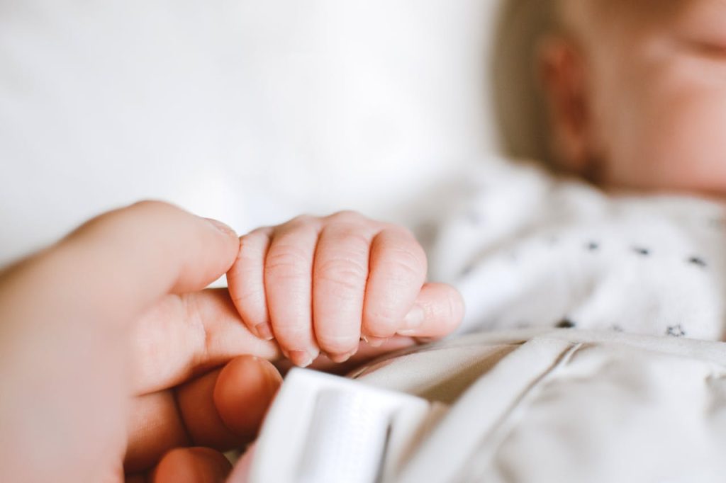 pexels-photo-2721581 Person Holding Baby's Hand